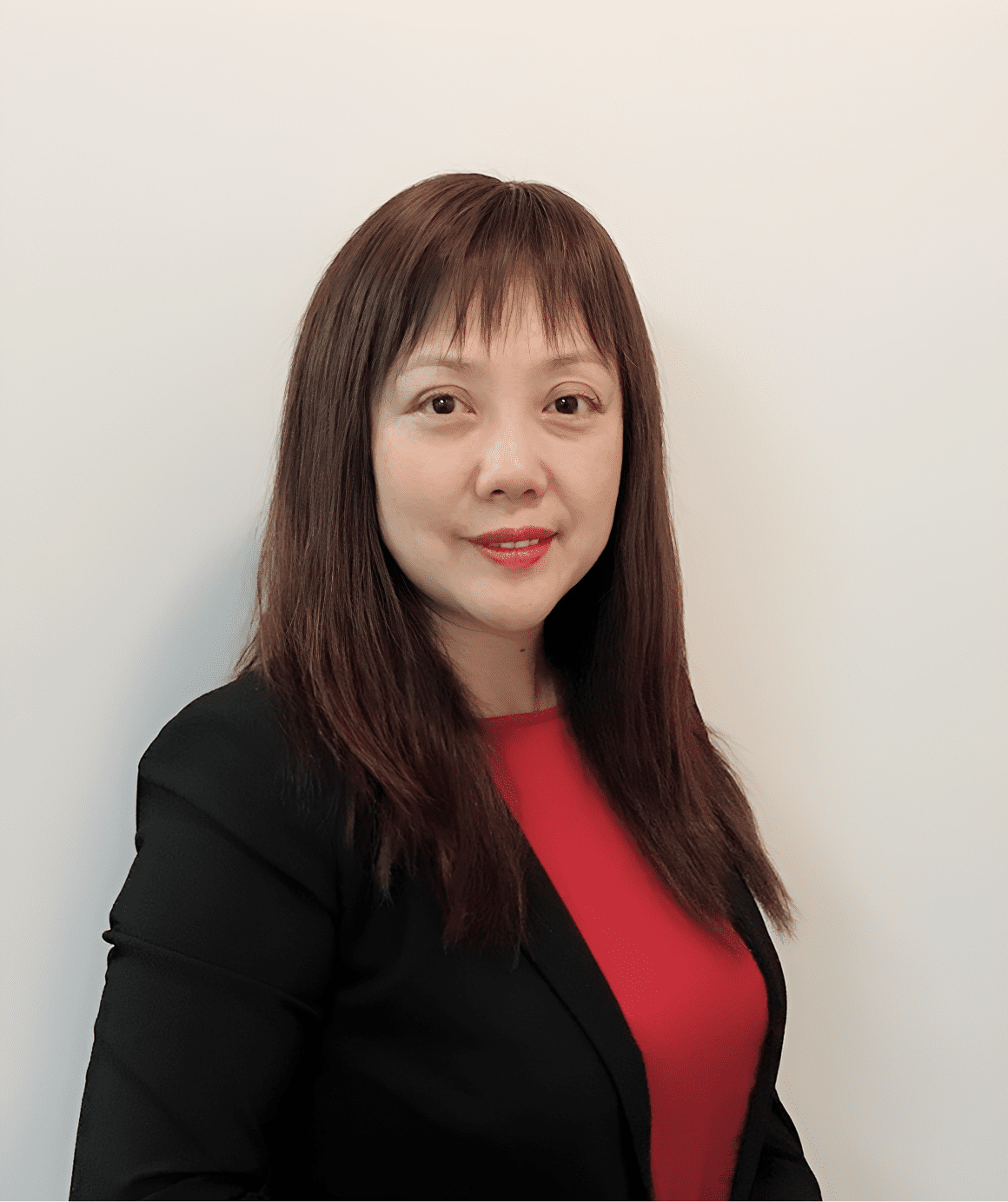 Confident woman against plain background