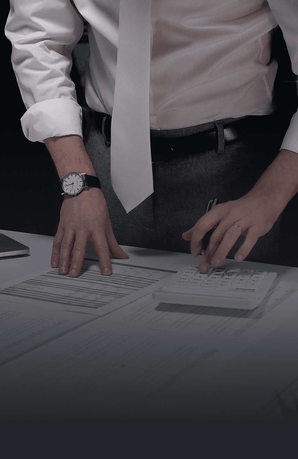 Office worker calculating financial data