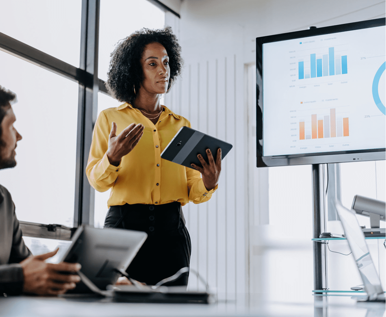 Businesswoman presenting data on screen